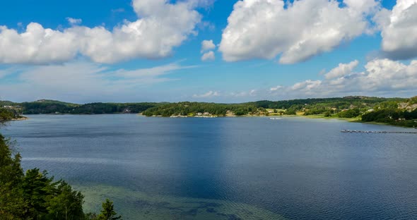 Beautiful Puffy Clouds in a Blue Sky over Lake in Sweden