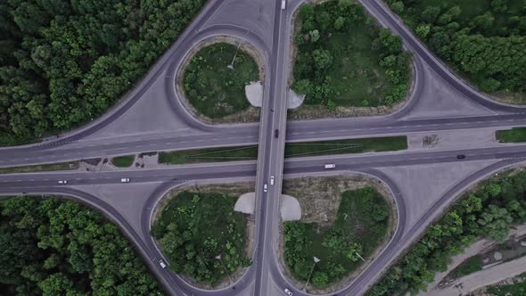 Aerial View of Road Junction with Moving Cars alt