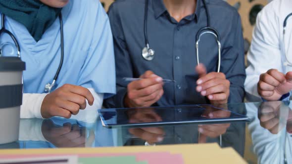 seated doctors shaking hands 4k alt