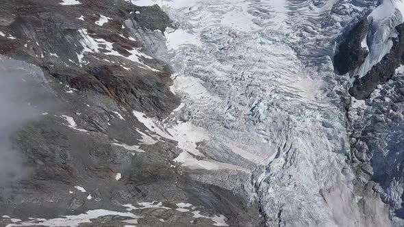 Panoramic aerial shoot of a glacier valley in the swiss alps in summer near Grindelwald alt