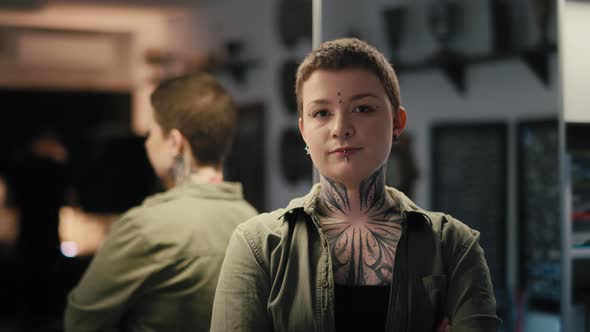 Portrait of young adult owner of tattoo salon. Shot with RED helium camera in 8K. alt