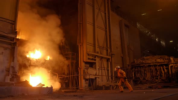 Metallurgist at Work By the Blast Furnance, Iron and Steel Works alt