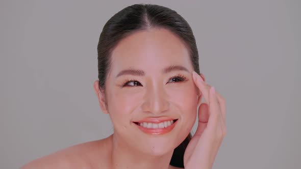 Portrait of Asian young woman with soft make-up and white skin. alt