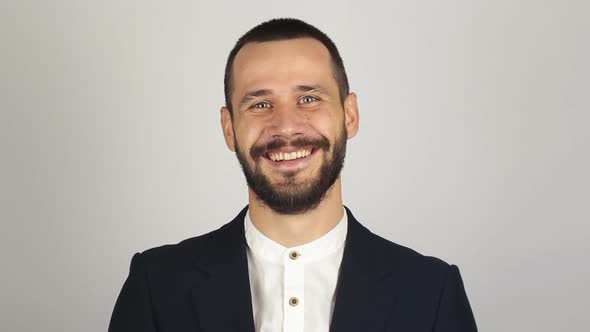 Young Successful Businessman Looking at the Camera and Smiling alt