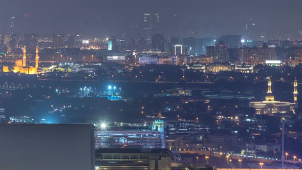 Skyline View of Deira and Sharjah Districts in Dubai Night Timelapse UAE alt