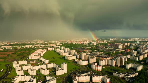 Rainbow over the city shooting from a height. It's raining,
