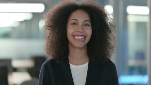 Portrait of African Businesswoman Smiling at the Camera alt
