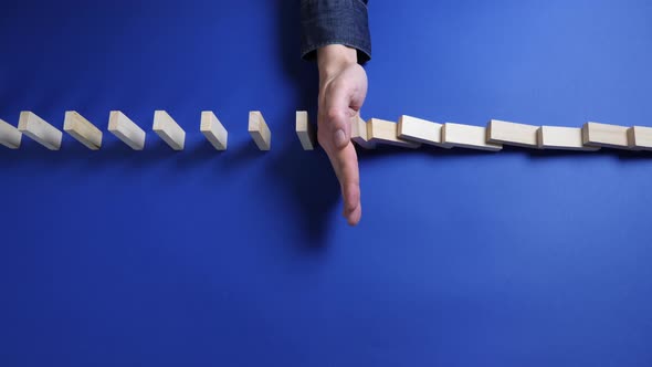 Wooden Blocks Falling in Line Domino Effect