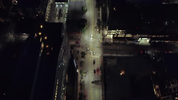Epic City Aerial At Night Panning Lit Street To Skyline Skyscraper Building Lights alt
