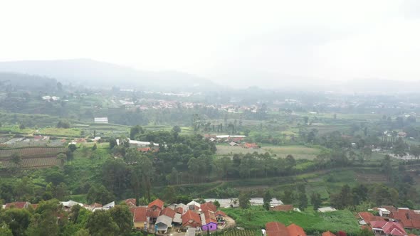 Aerial view of a foggy farm field in suburban area in Asia country