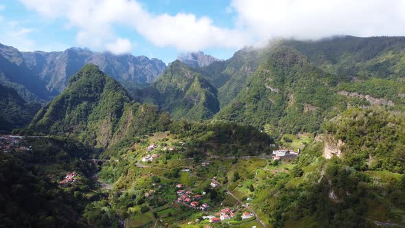 Drone view of a mountain village in Madeira Island, Portugal. Rural holidays. Travel the world.