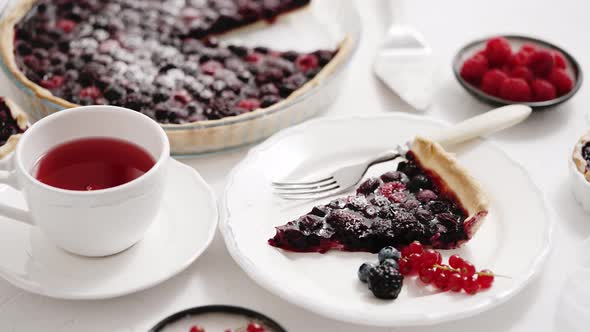 Delicious Homemade Piece on a Plate and the Whole Homemade Forest Berry Tart