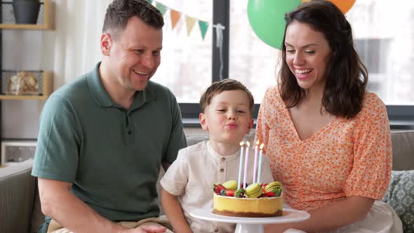 Happy Family with Birthday Cake at Home alt