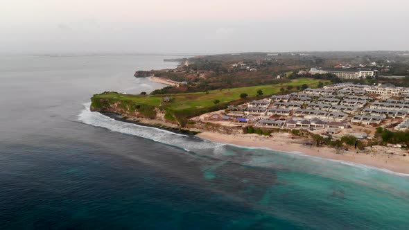 Aerial View of Sand Beach with Rocks and Green Cliff, Bali alt