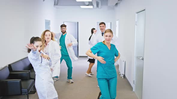 In a Modern Hospital Corridor Group of Doctors and alt