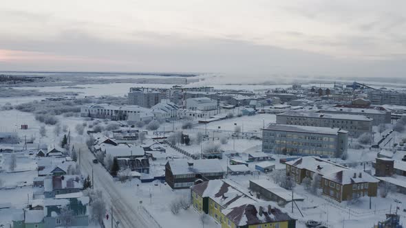 Winter Establishing Shot to a Siberian City at the North Pole at Sunset