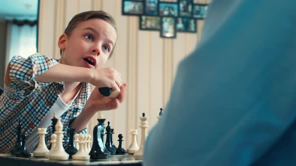 Blue-eyed kid playing chess