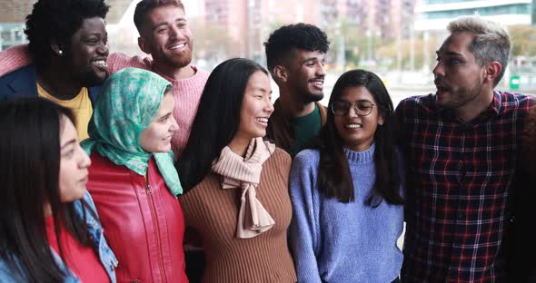 Young diverse people having fun outdoor laughing together - Diversity concept alt