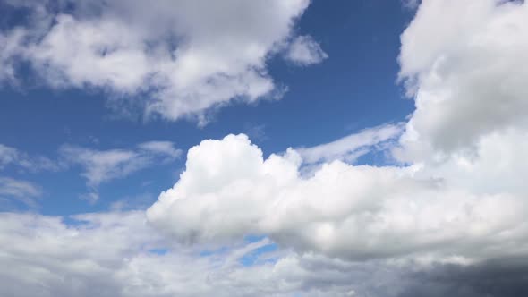 time-lapse of fast-moving cumulus clouds