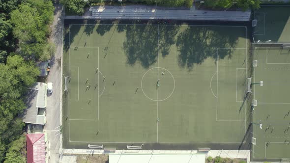 Football Stadium in the City Between the Blocks Drone View alt