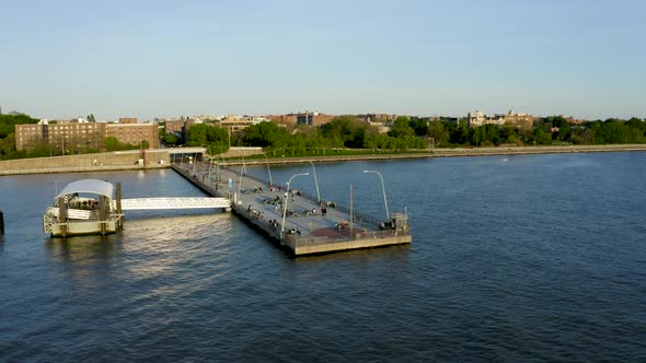 Aerial Establishing Shot of Pier next to an Urban Neighborhood (Bay Ridge, Brooklyn, New York) alt