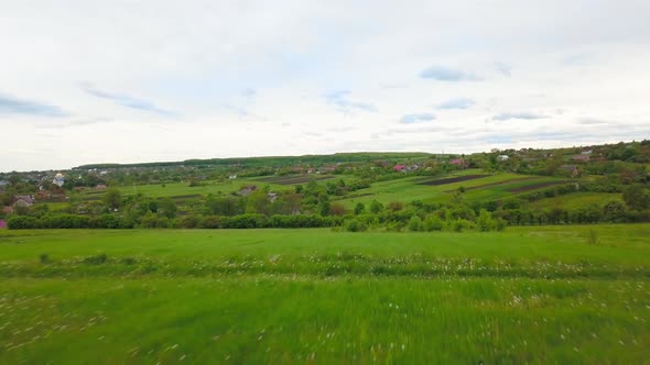 Aerial Drone View of Green Agricultural Field in the Countryside of Ukraine