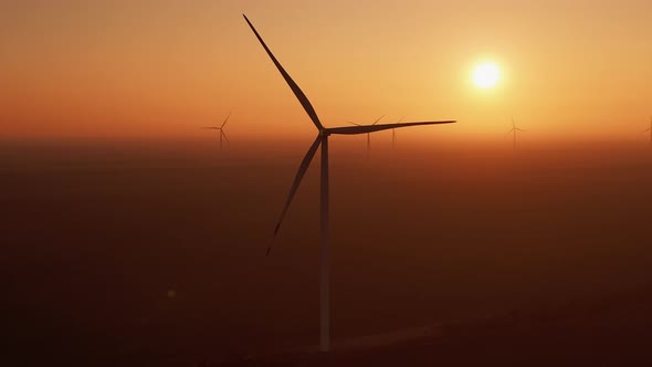 Wind Driven Generators Produce Clean Energy Against Sunset