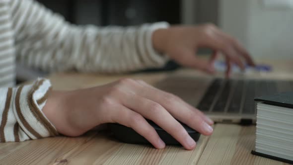 close plan of teenager student hands at computer