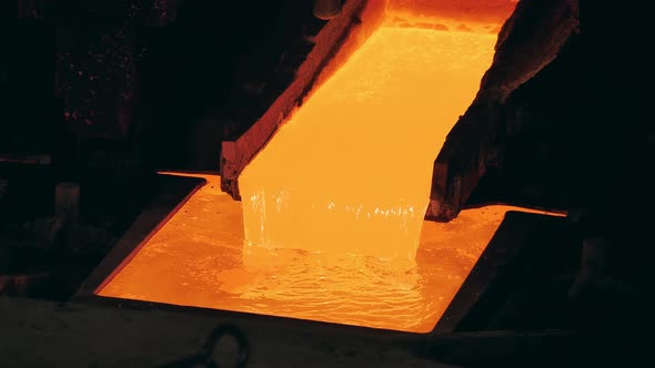 Molten Copper is Flowing Between Industrial Reservoirs alt