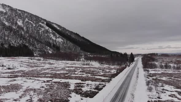 Frozen road in an isolated valley filmed with drone -  Toundra landscape