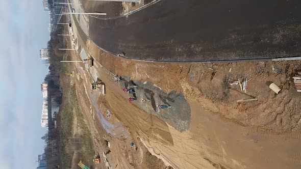 Vertical Video Heavy Special and Cargo Vehicles Build a New Road for Transport