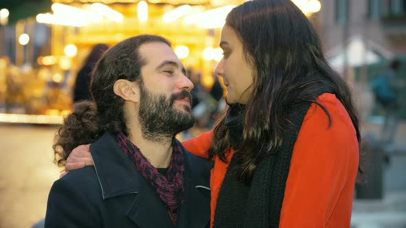 Romantic Attractive Young Lovers Flirting in The City at Christmas alt