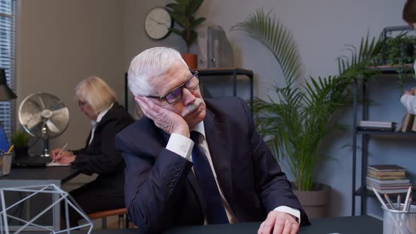 Senior Bored Tired Male Professional Manager Web Designer Making Online Work at Office Workplace alt