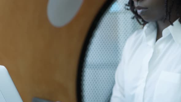 Serious Young Businesswoman Working with Laptop alt