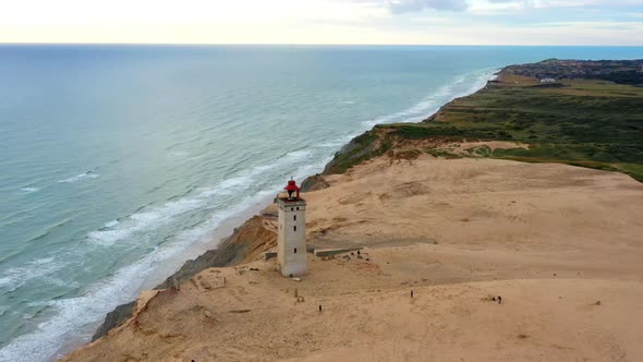 Drone Over Rubjerg Knude Lighthouse And Coastline alt