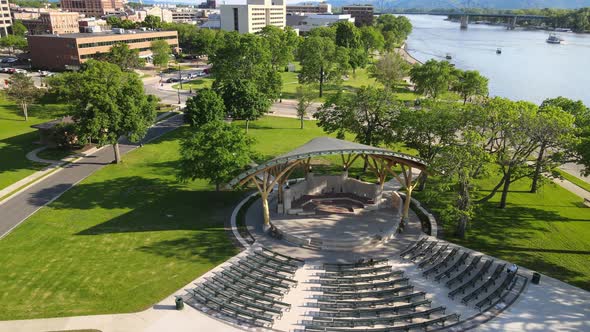 Drone view of park venue along Mississippi River in La Crosse, Wisconsin on a bright sunny day.