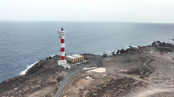 Tenerife Canary Islands Lighthouse at the Atlantic Ocean Alog the Volcanic Cliffs Rocky Coastline alt
