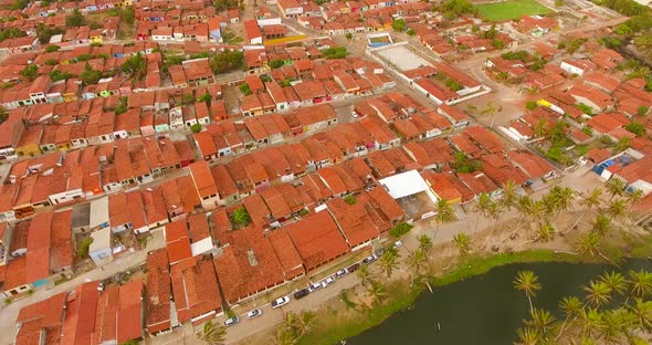 Aerial view of rooftops and small streets of Rio do Fogo town, Brazil. alt