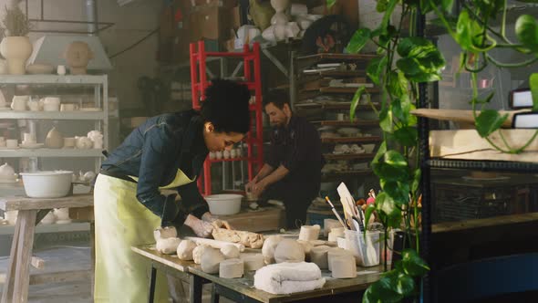 Man and Woman Are Working In Pottery Studio