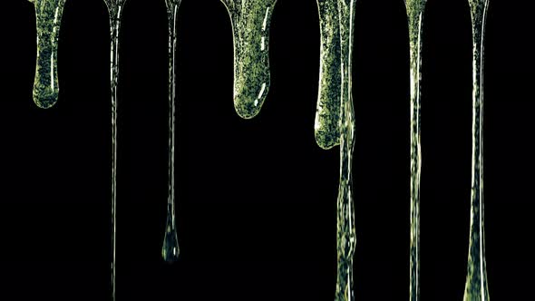 Colored Mucus Flowing From Top To Bottom on the Dark Background alt