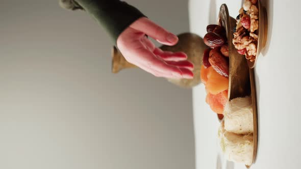 Vertical Video of Turkish Tea and Sweets Hot Drink in Traditional Armudu Glass Closeup alt