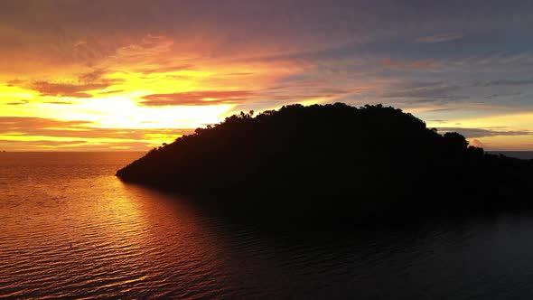 cinematic shot of a tropical island in the Indian Ocean near Madagascar at sunset alt
