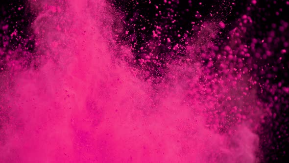 Super Slowmotion Shot of Color Powder Explosions Isolated on Black Background alt