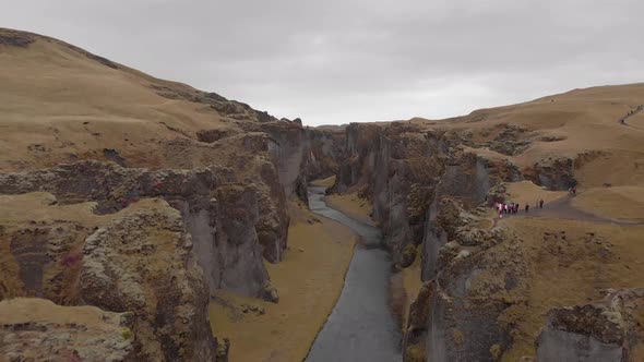 Cinematic aerial flyover of stunning Icelandic canyon. alt