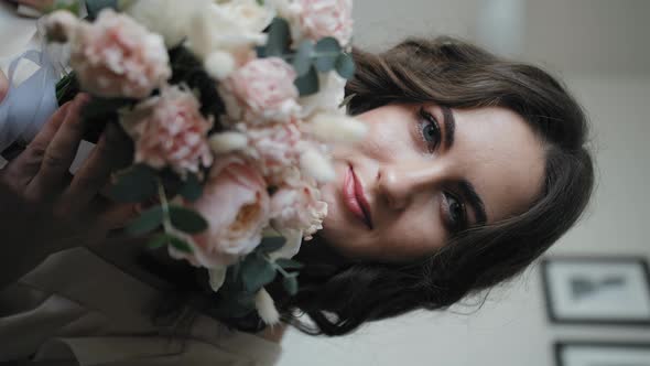 Vertical Portrait of a Girl with a Bouquet of Flowers alt