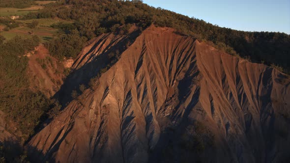 Aerial view of a beautiful ravine at dawn in Bettola, Emilia-Romagna, Italy. alt