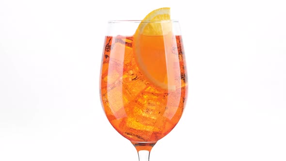 Download Aperol Spritz Cocktail With Ice Isolated On White Background By Lohvynenko