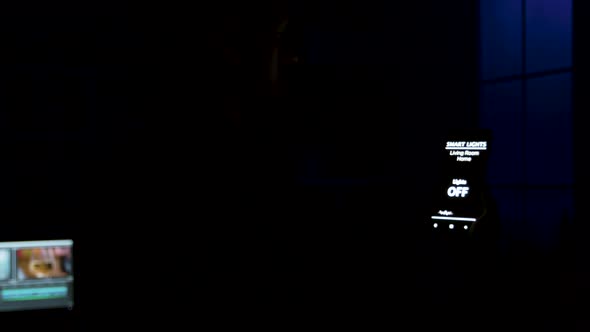 Close Up Shot of Man Using a Voice Command to Turn on the Lights in the Room alt