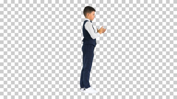 Concentrated boy using digital tablet while standing, Alpha Channel alt