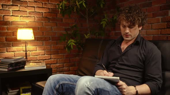 Young Successful Businessman Working in Office at Night alt